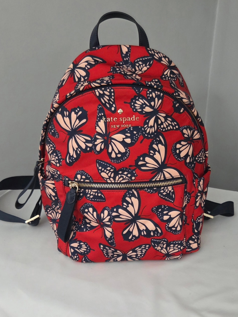 Kate Spade Red Butterfly Print Backpack with Navy Accents